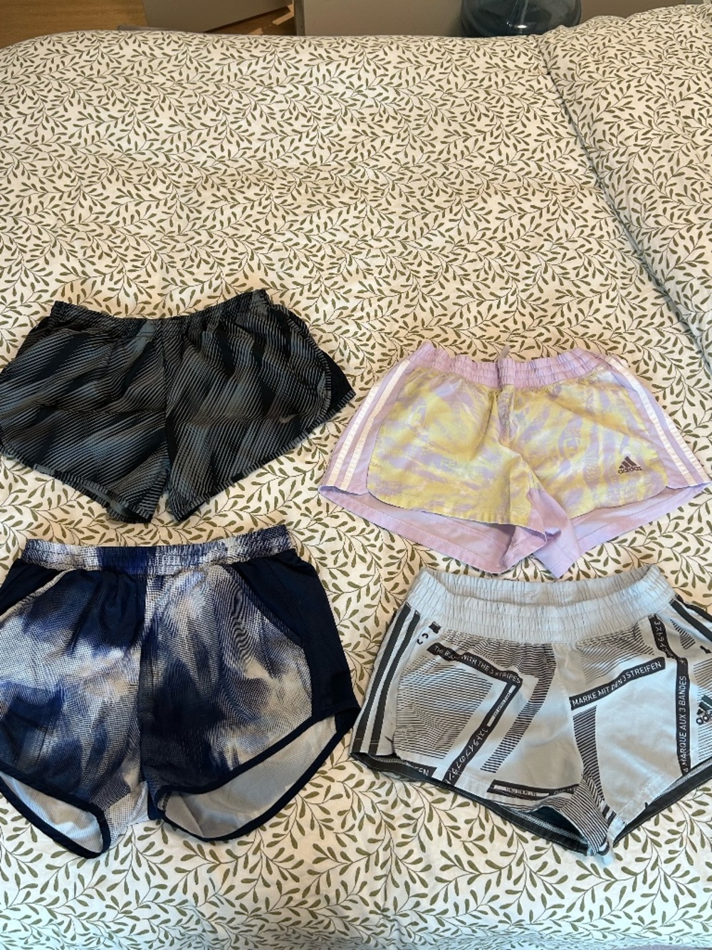 4 pairs of athletic/running shorts (Adidas, Nike, Under Armour)